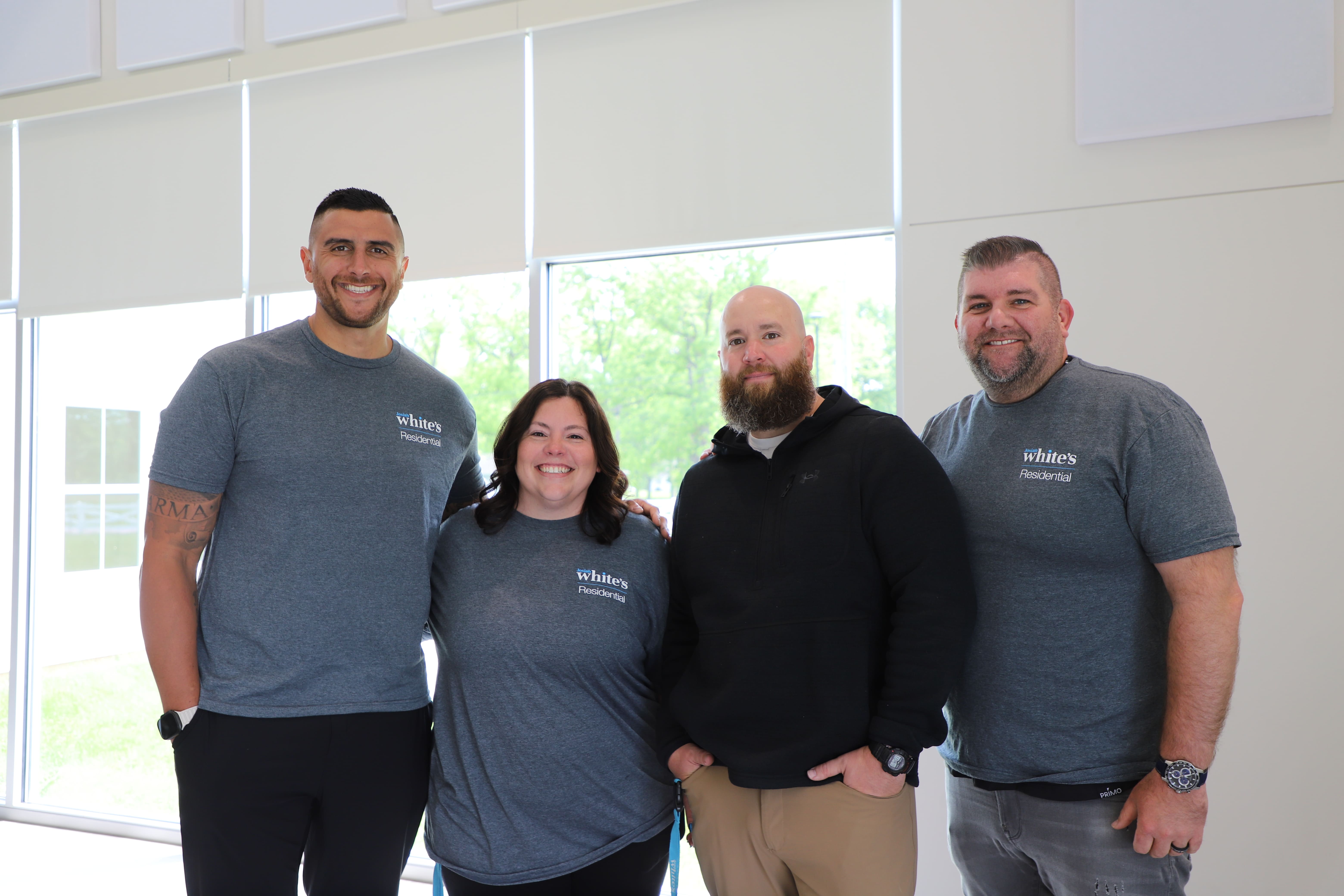 Beautiful Soles: The Steps of my Story: Josiah White's President & CEO, Matthew Purkey, and Residential Therapist Staci Hyden, stand for photo with Jonathan & Jared from Marsh McLennan Agency who generously donated new Nike Air Force 1s to residential students in the Art Intervention therapy program.